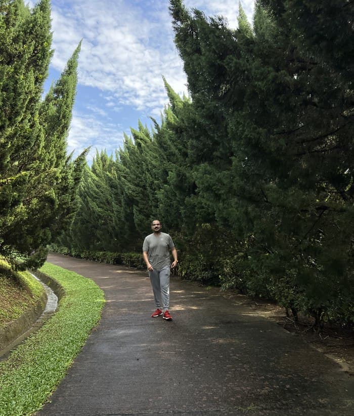 Hamza on a tree-lined path